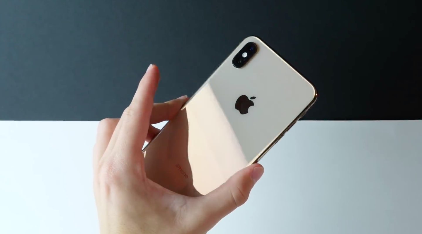iPhone XS Max review - a photograph showing off the glass back of the phone along with the dual-camera system