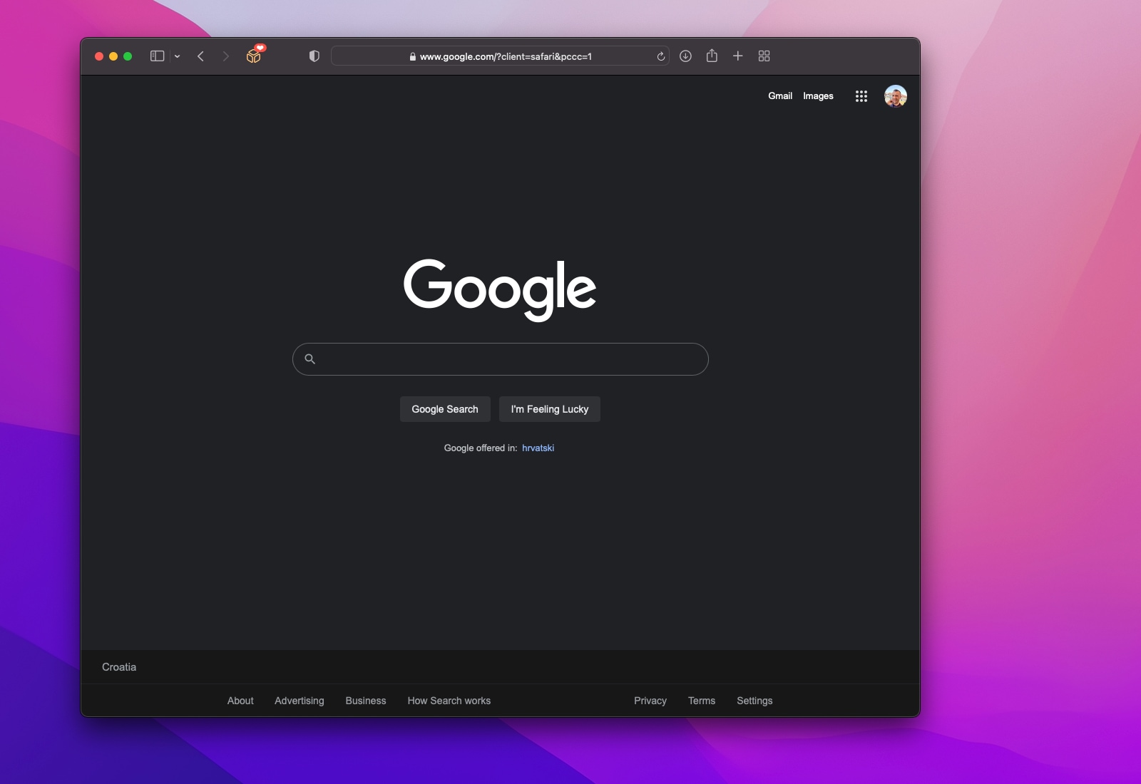 A screenshot of the Google search homepage in Safari for Mac showcasing the pure-black dark mode