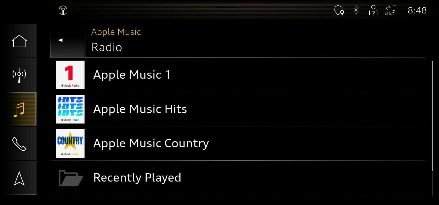 Apple Music's native integration in Audi's 2022 models is showcased in this press photo, with the Apple Music Radio section displayed on a car's Multi-Media Interface screen