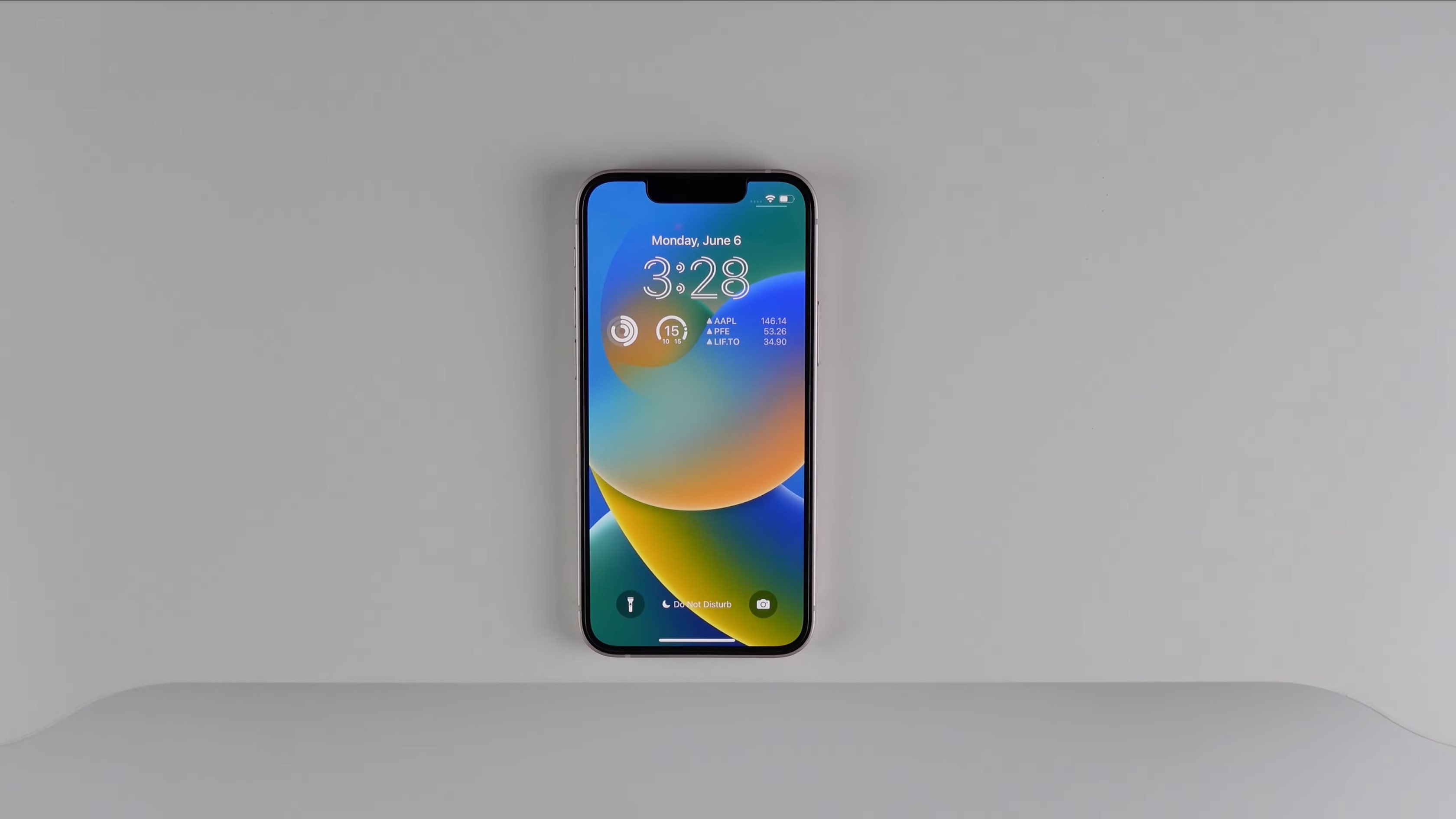 This image by iDownloadBlog showcases the iPhone's redesigned lock screen in Apple's iOS 16 software featuring improvements such as widgets, custom typeface for the current time and more.