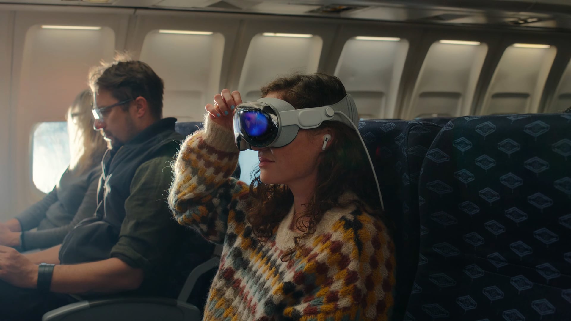 Woman watching movies on a plane on Apple's Vision Pro headset