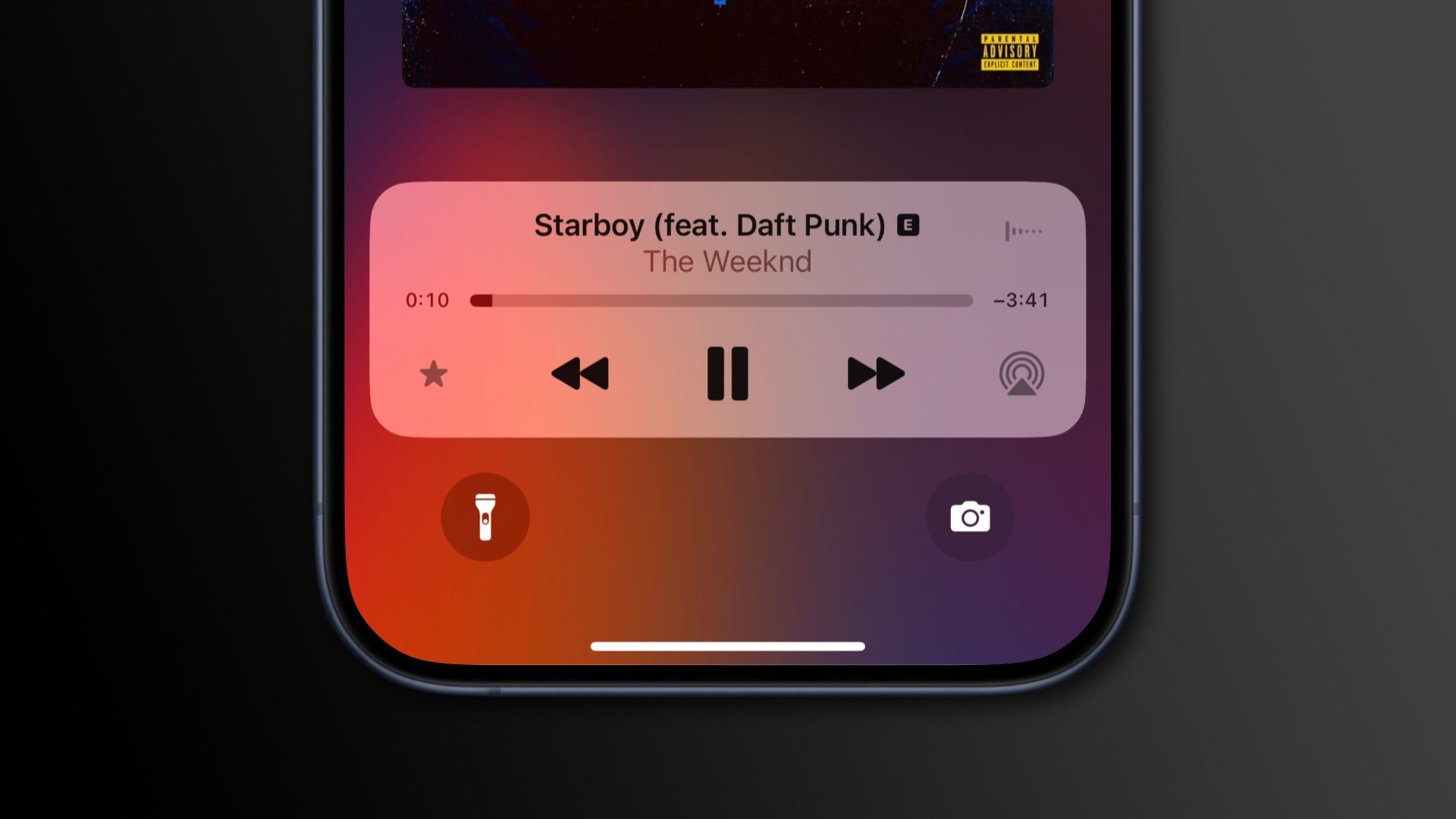 The iPhone's Lock Screen with Now Playing showing a Favorite icon 