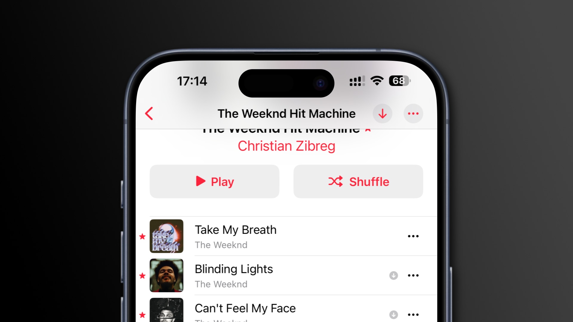 Track listing on Apple Music showing star icons next to favorited songs