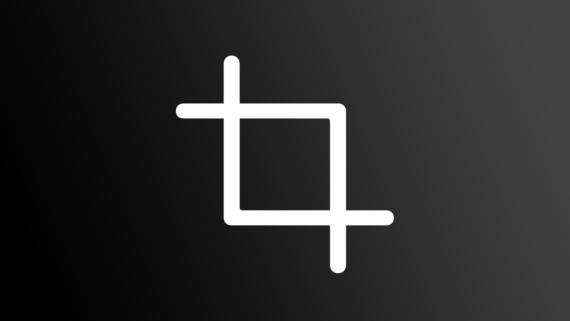 A white image crop symbol set against a black gradient background 