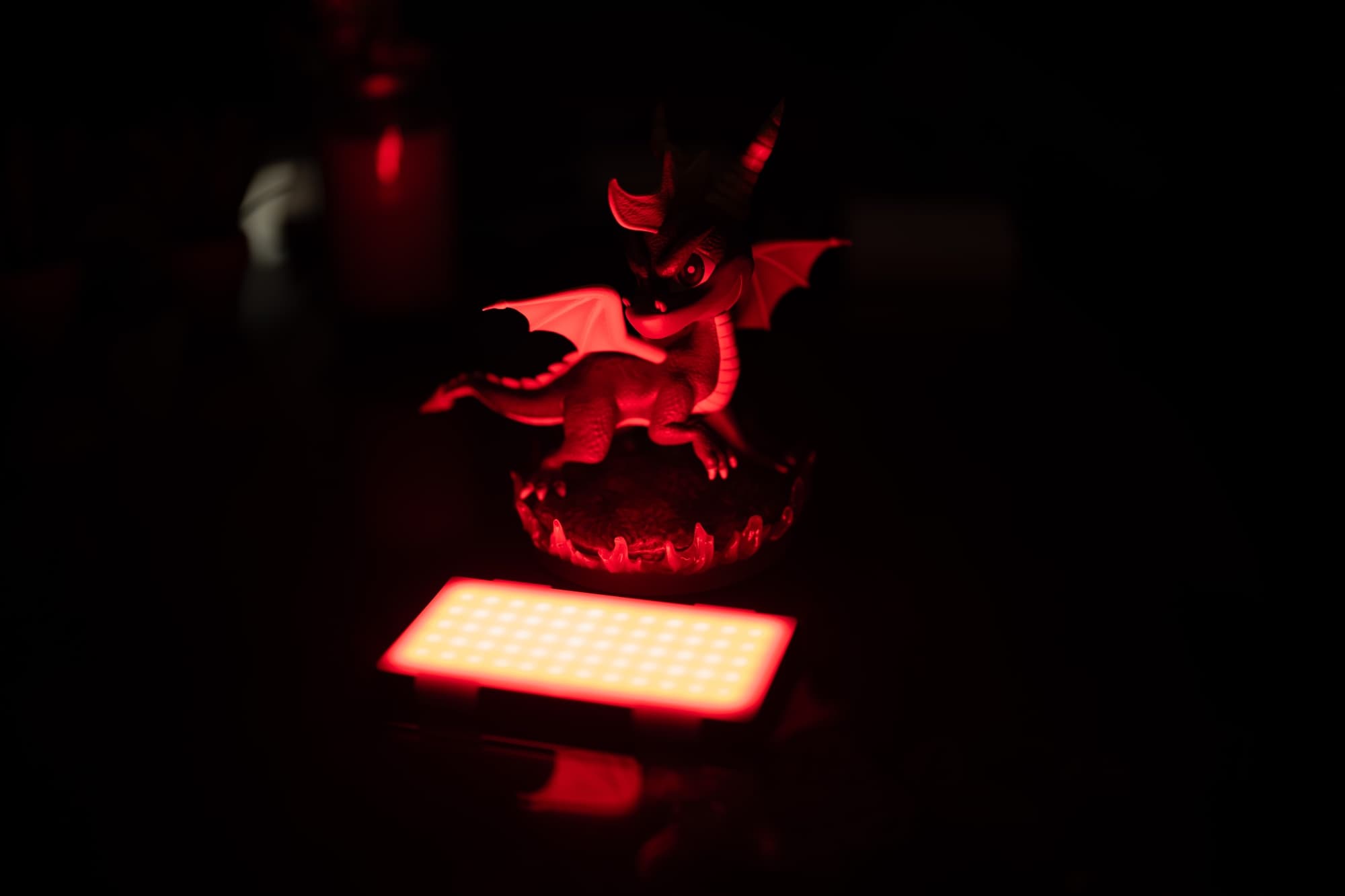 Using the  to cast a red light on a figure.