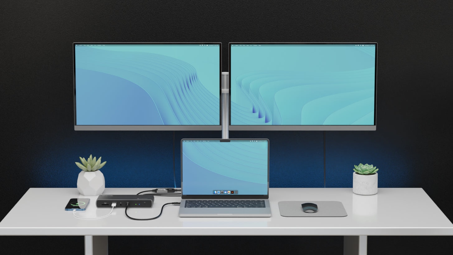 Plugable's docking station connected to a MacBook and two external 4k displays