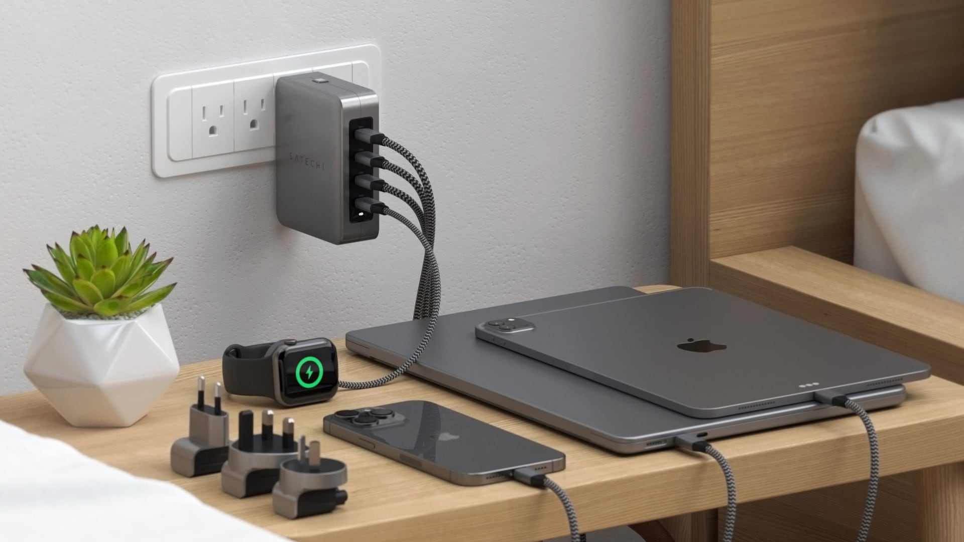 MacBook Pro, iPad Pro, iPhone 15 Pro and AirPods Pro plugged into Satechi's 145W travel charger 