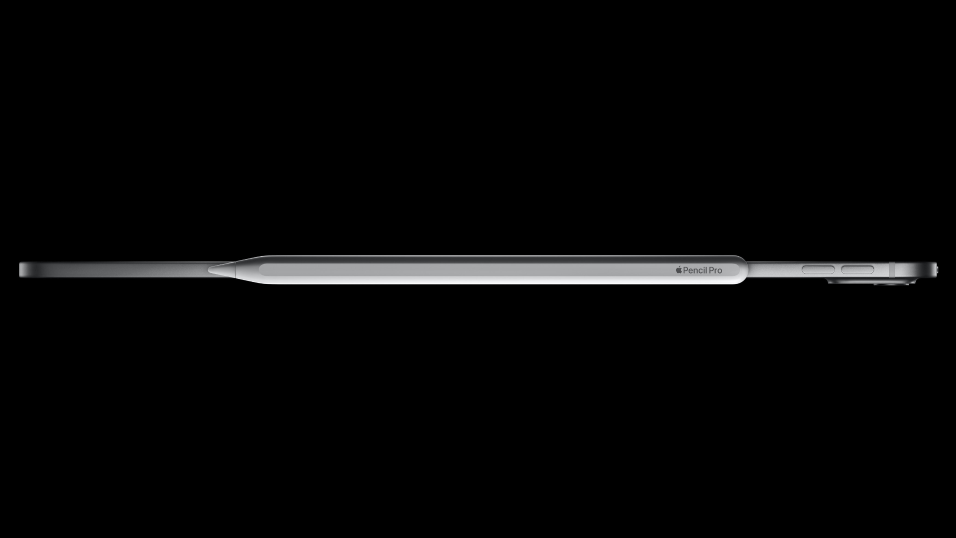 OLED iPad Pro laid flat with Apple Pencil Pro next to its side, set against a soldi black background