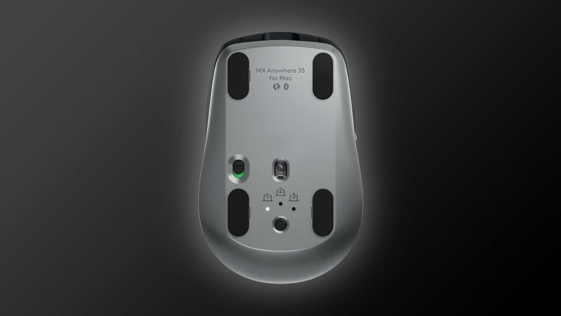 The bottom side of Logitech's Mac mouse, set against a dark gradient background