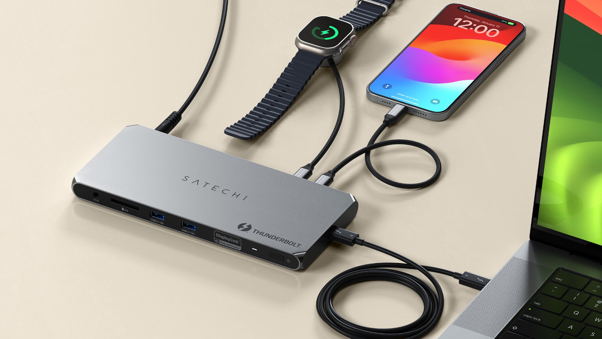 The rear ports on Satechi's Multi-Displays Thunderbolt Docking Station charging iPhone and Apple Watch while connected to a Mac laptop