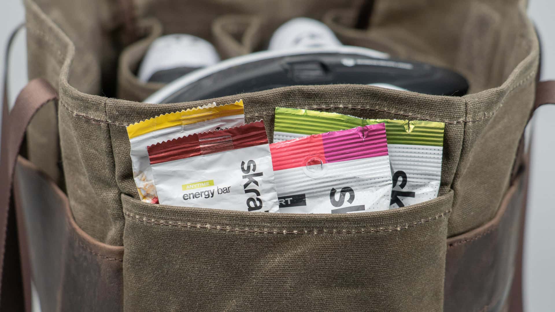 WaterField's leather cycling tote with snacks in a side pocket