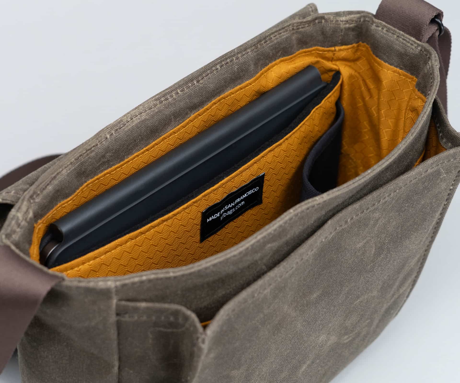 iPad inside the tablet compartment of WaterField's Shinjuku messenger bag