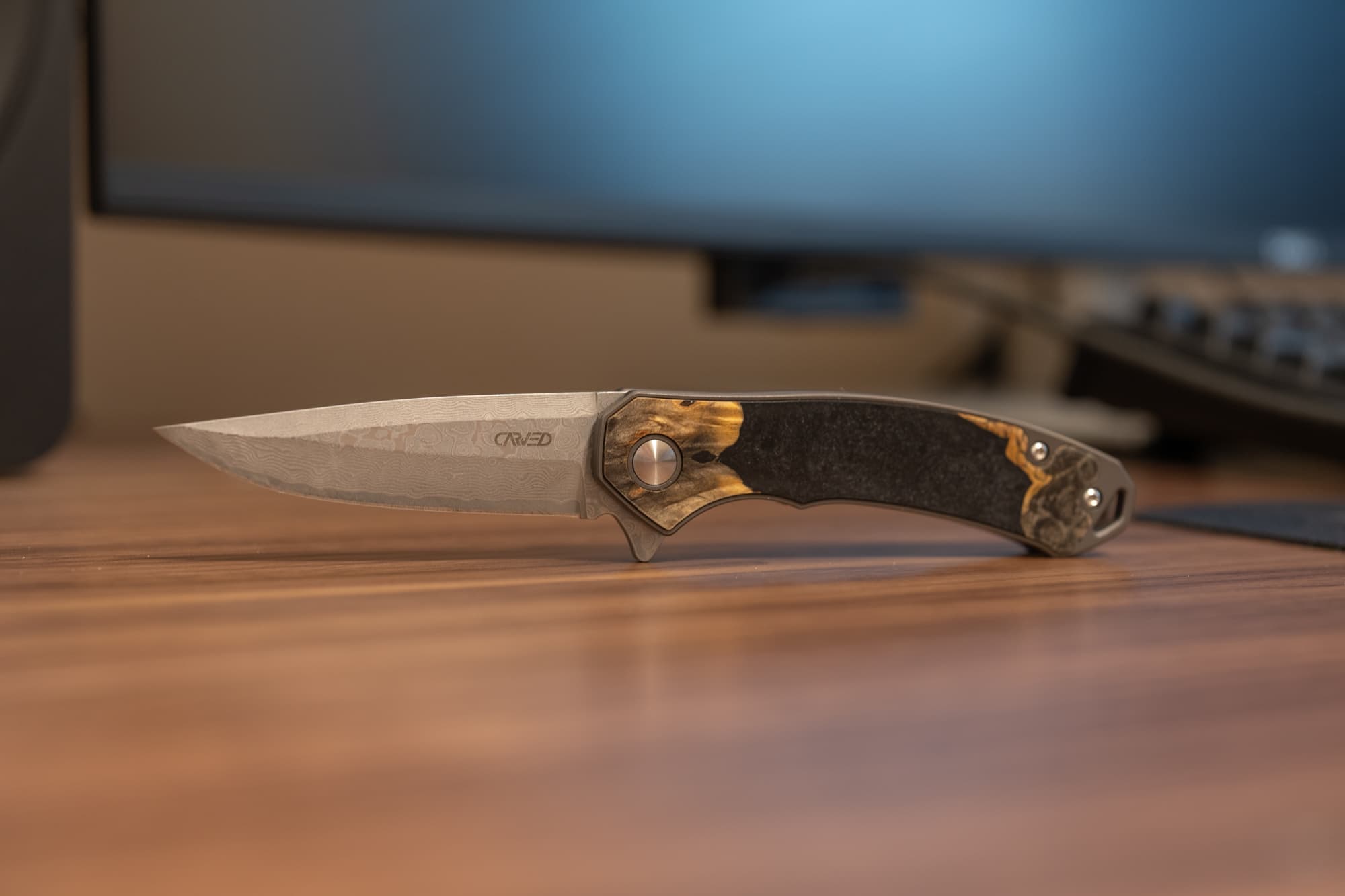 Carved EDC pocket knife blade.