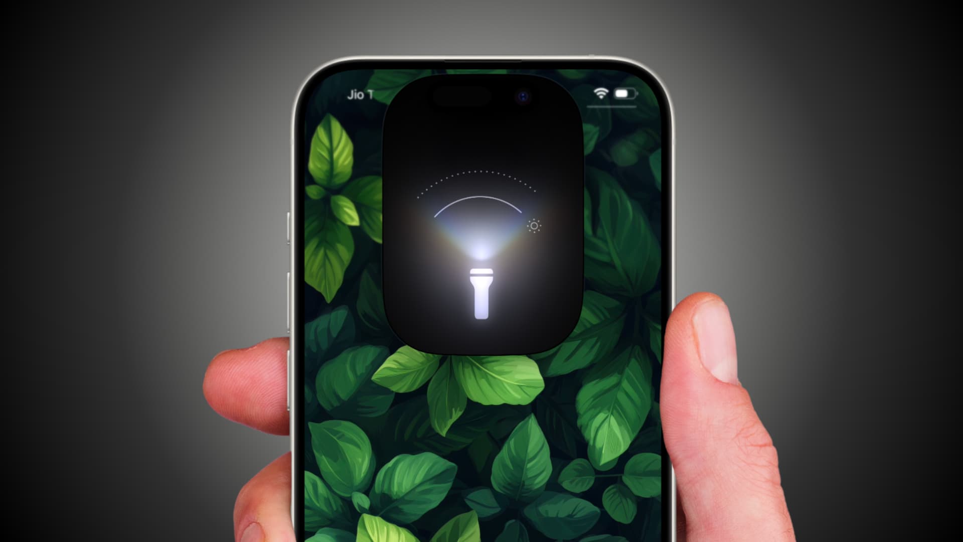 Holding iPhone with its flashlight activated