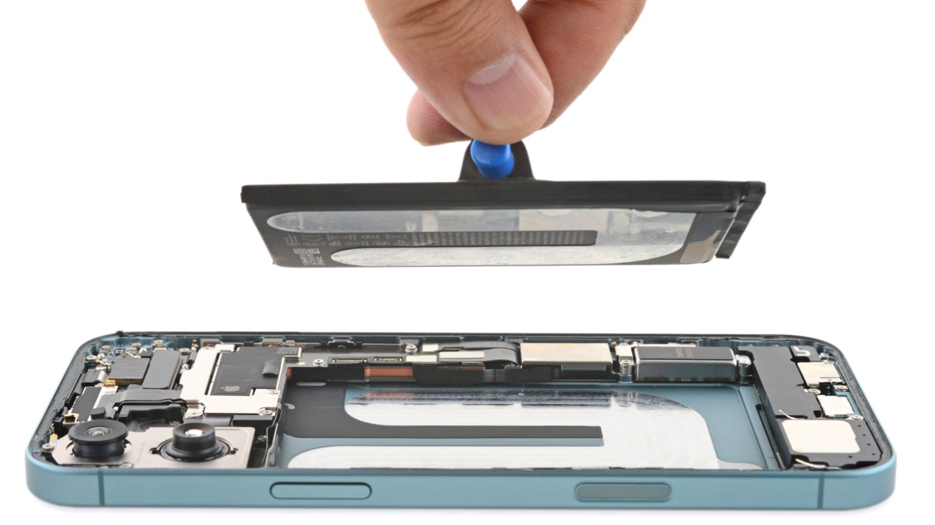 iPhone lying facedown with its backside open and male thumb and index finger holding the battery above the phone.