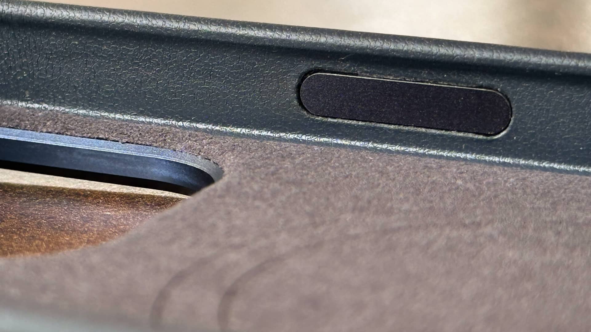 Closeup of the power button on Mujjo's MaizCase for iPhone 16 Pro Max.