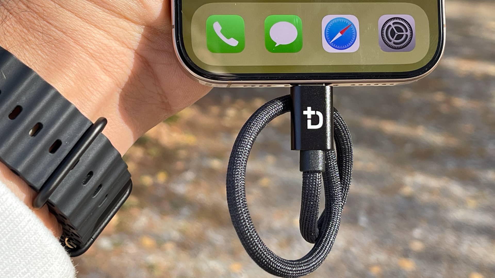 Closeup of an iPhone bottom with a USB-C cable plugged.