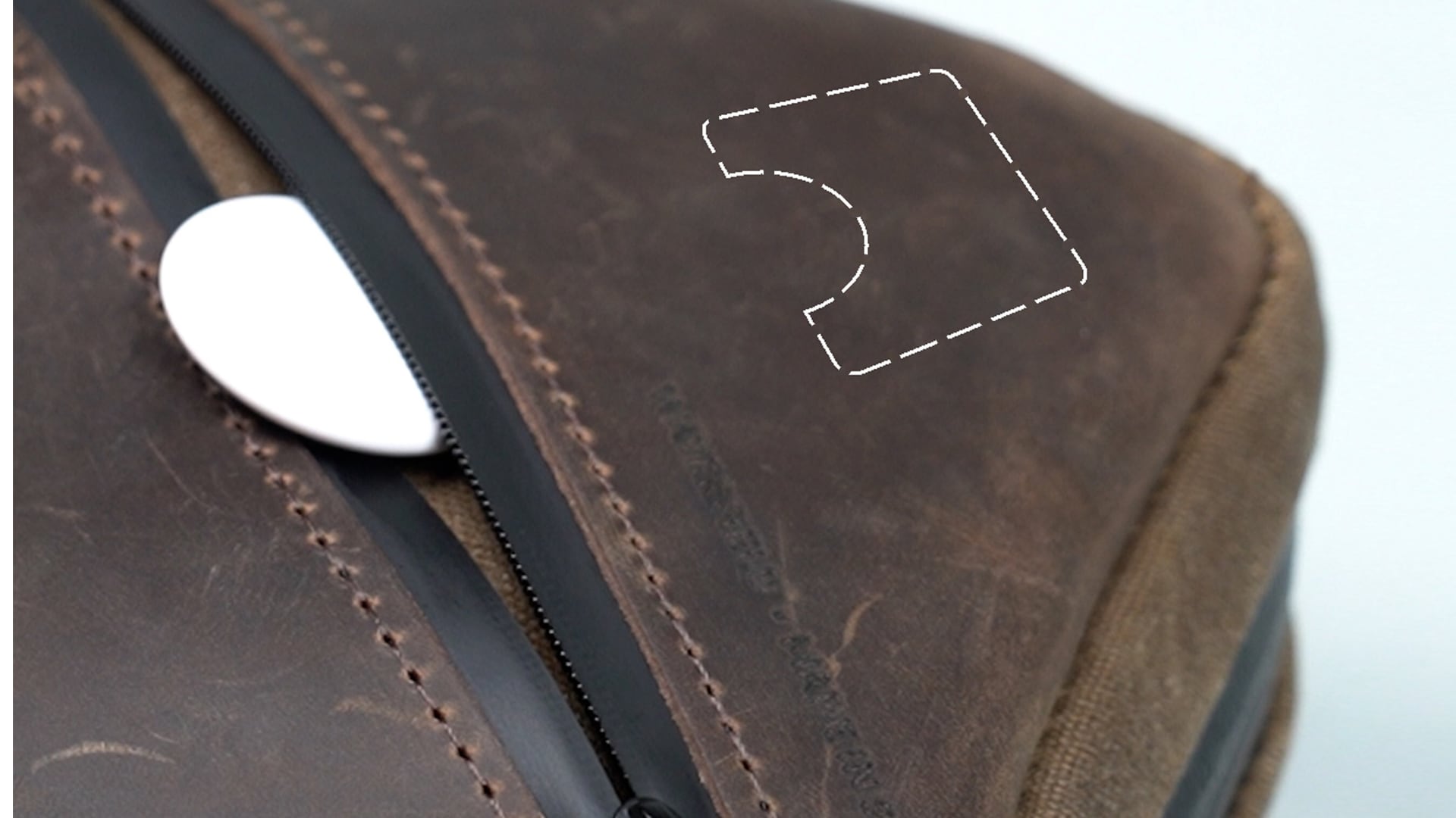 Closeup of Waterfield's Mac mini case with an AirTag in a hidden pocket.