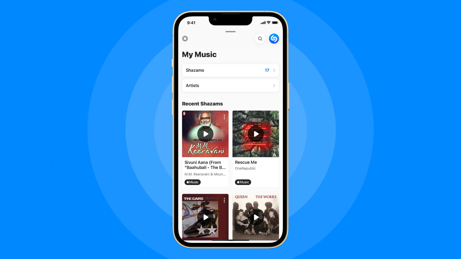 Shazamed song history on iPhone on blue background