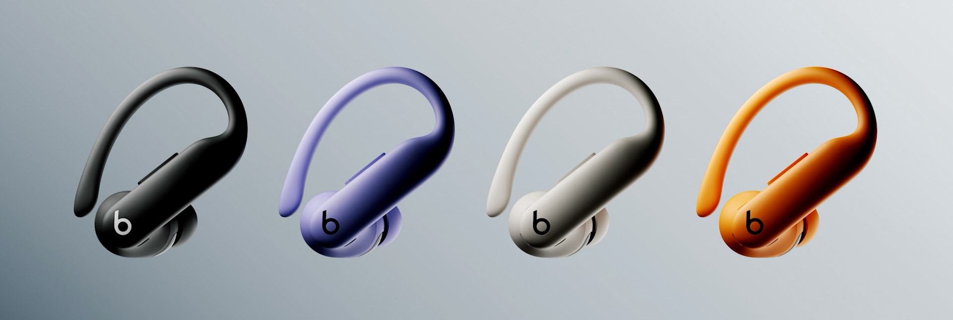 Four Powerbeats Pro 2 earbuds in the Jet Black, Hyper Purple, Quick Sand and Electric Orange color finishes.