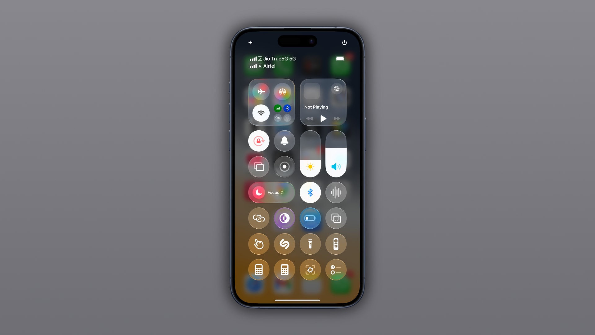 iPhone showcasing the Control Center design in iOS 26 beta 2.