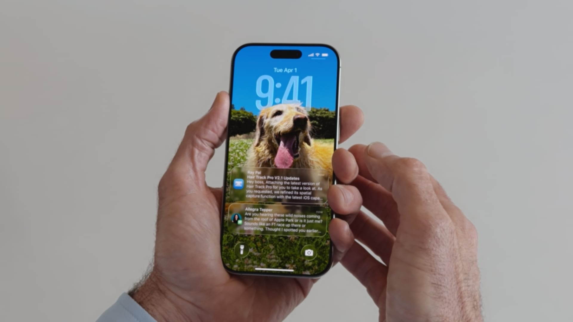 iPhone on the Lock Screen, held in male's hands/