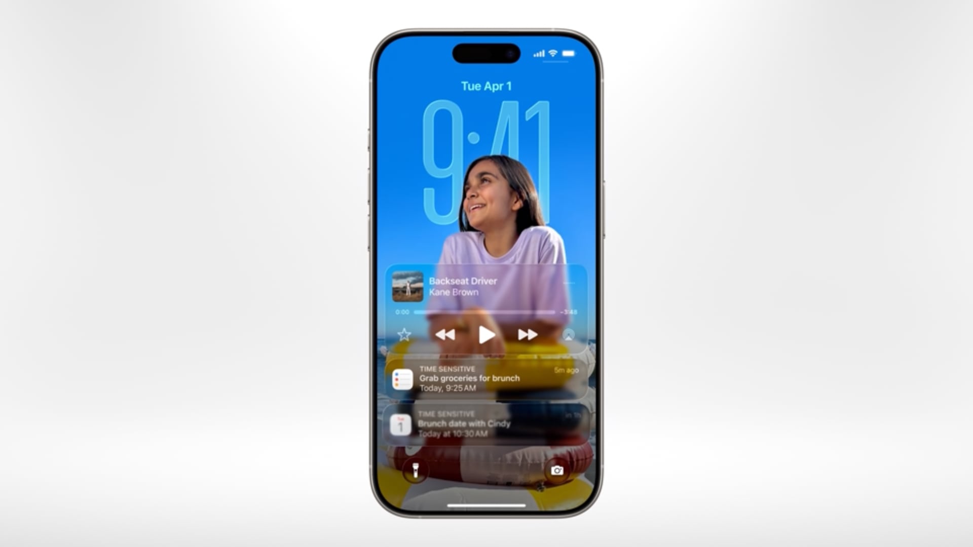 iPhone showcasing the redesigned Lock Screen on iOS 26.