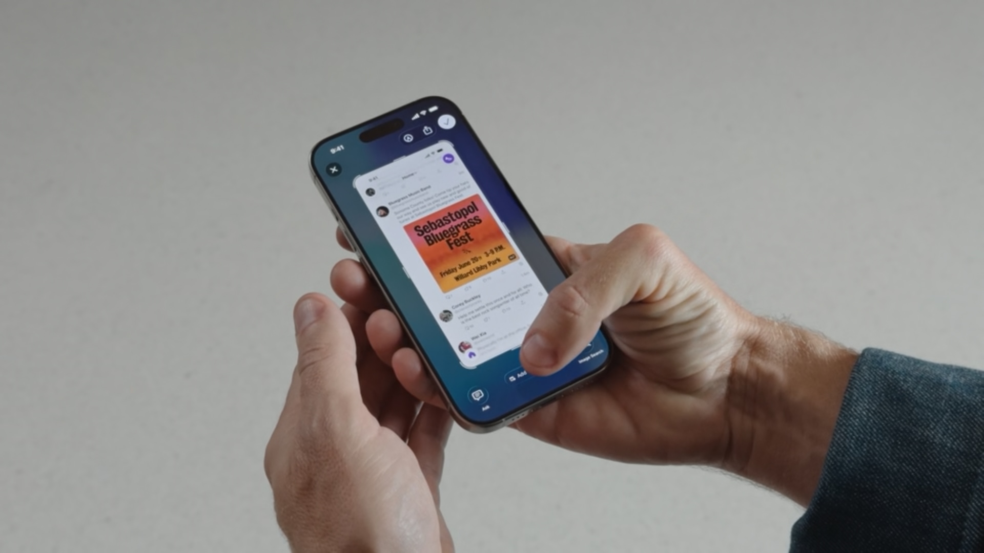 iPhone held in hands, showing an app screenshot, with the finger touching the option to add a detected event to the calendar.