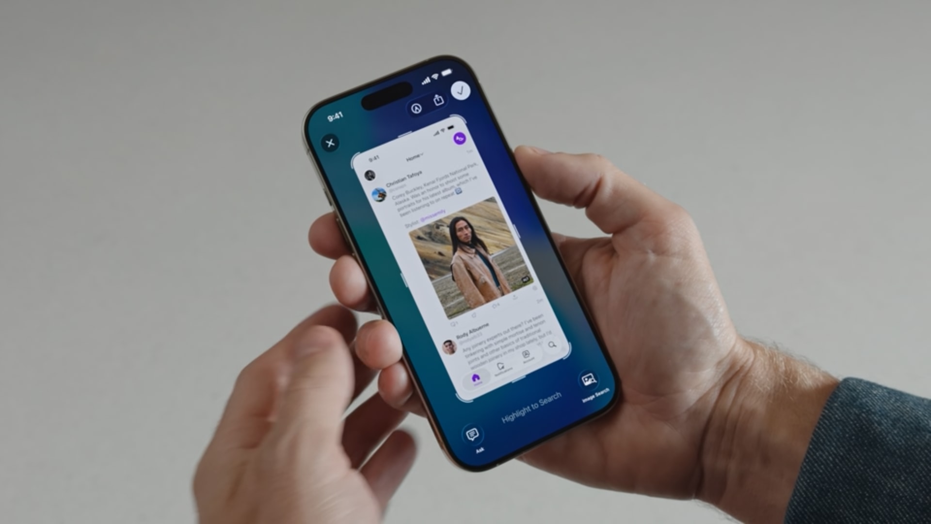 iPhone held in hands, showing a screenshot thumbnail and the visual intelligence options at the bottom.