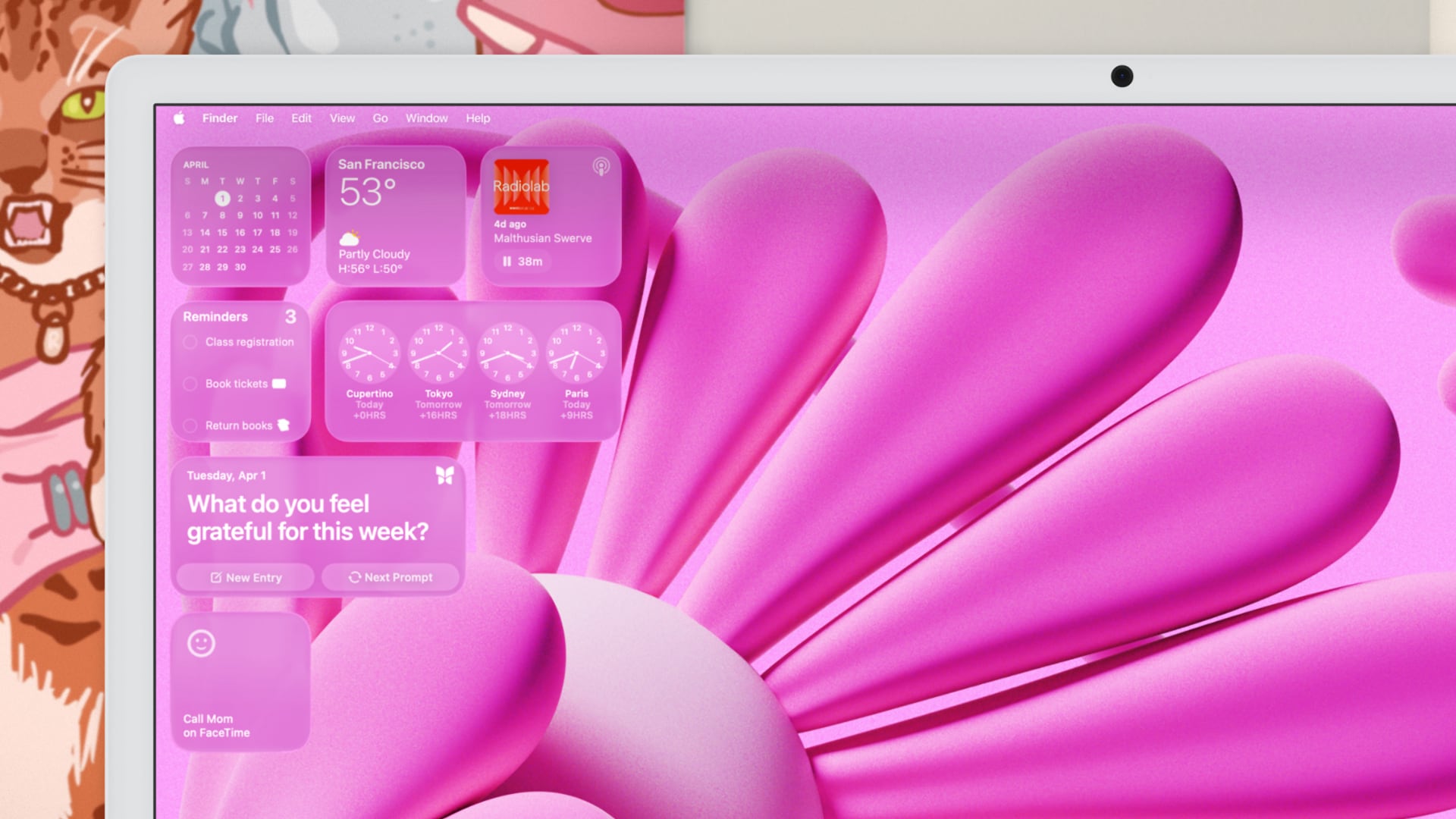 Closeup of a MacBook display showcasing pink-tinted icons and widgets.