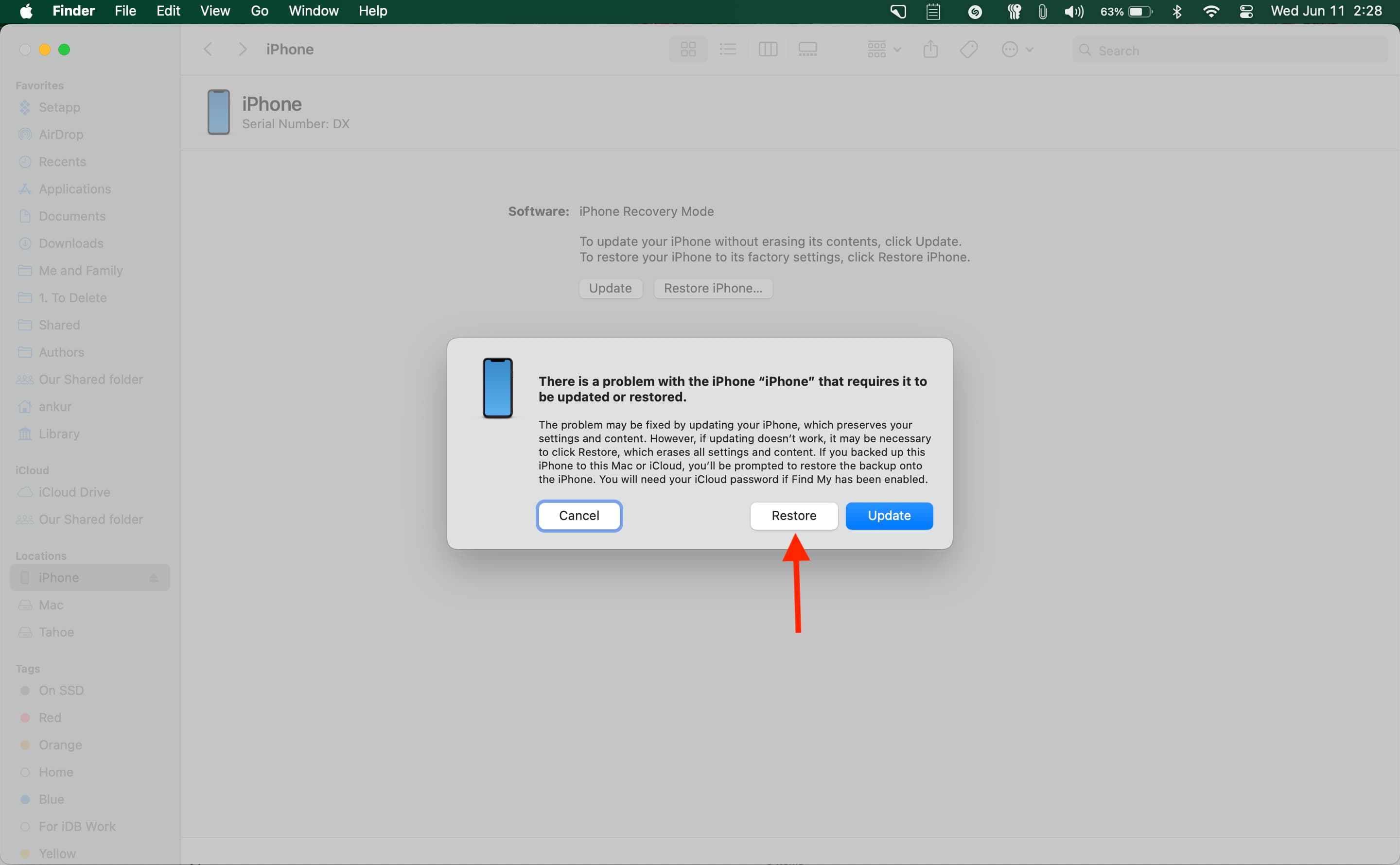 Finder on Mac showing prompt to restore iPhone