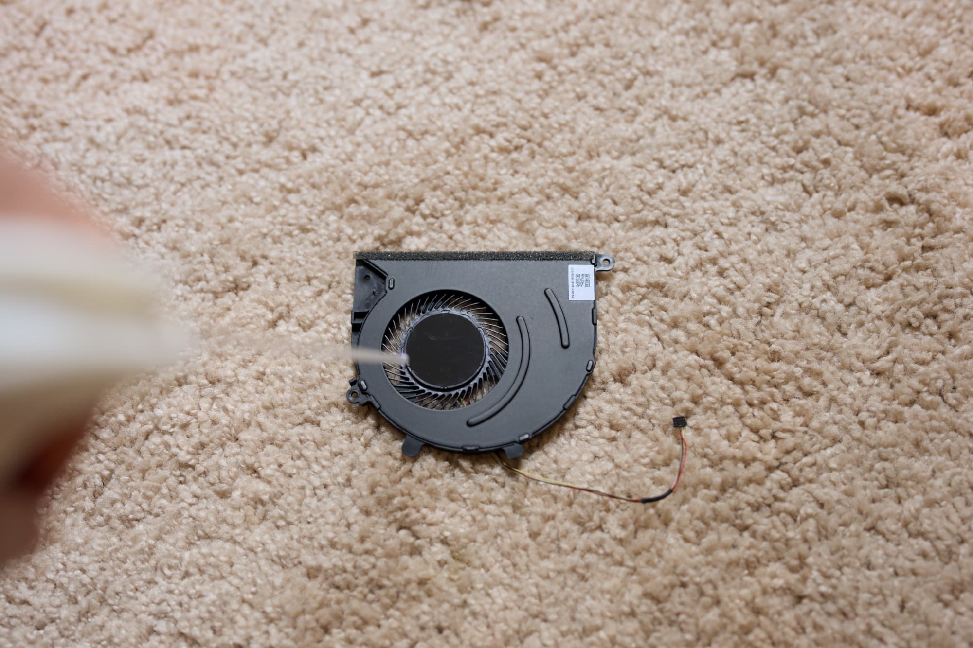 Compressed air to clean laptop cooling fan.